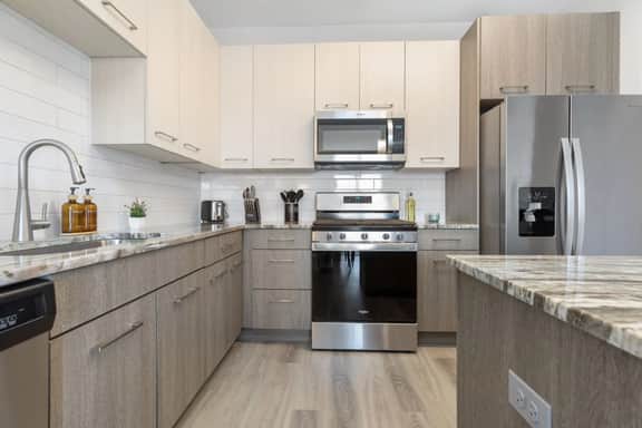Resort-Style 2BR Gateway | Sauna, Pool, BBQ, Gym